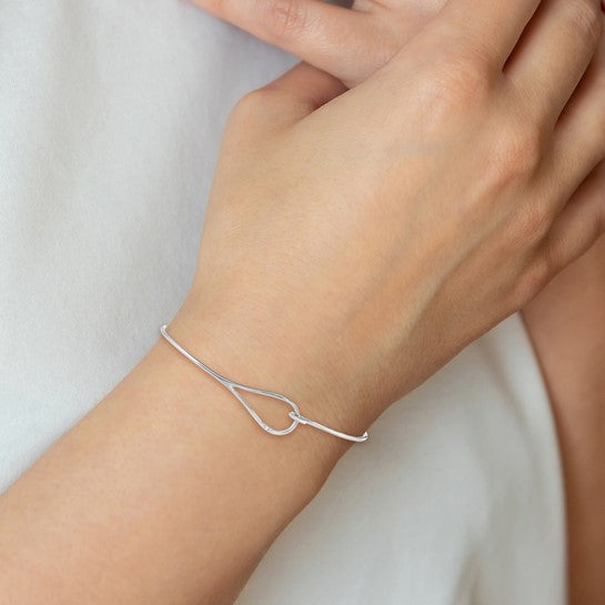 A photo showing a beautiful silver bracelet